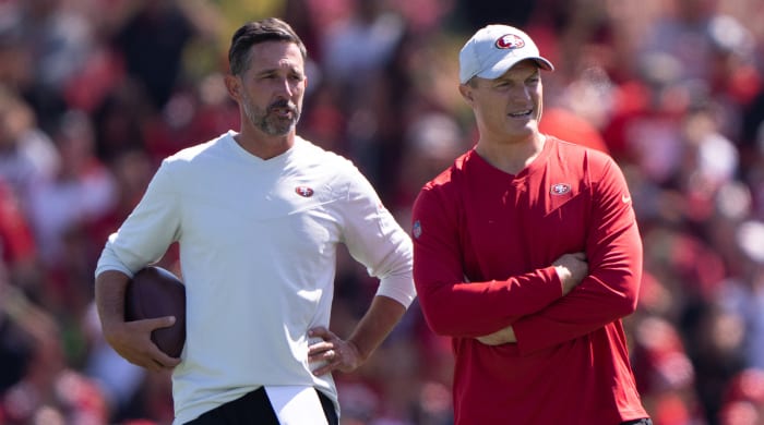 49ers coach Kyle Shanahan, left, and GM John Lynch stand together on the practice field